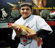 Youngster with albino catfish
