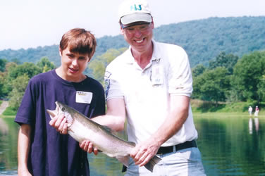 Teen Angler, volunteer and nice trout