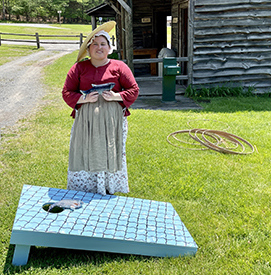 Fort Delaware Asst. Director Alexis Patterson is all dressed up and ready to play shad cornhole! Photo by the DRBC.