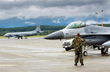 A 177th F-16 shares the tarmac with a Canadian Air Force P-3. American, Canadian and NATO forces trained for both land and sea battles. -- Click to Enlarge