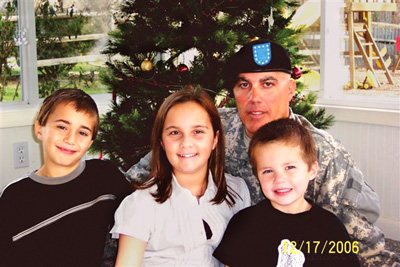Pfc. Love with his children (left to right) Hunter, Samantha, Parker