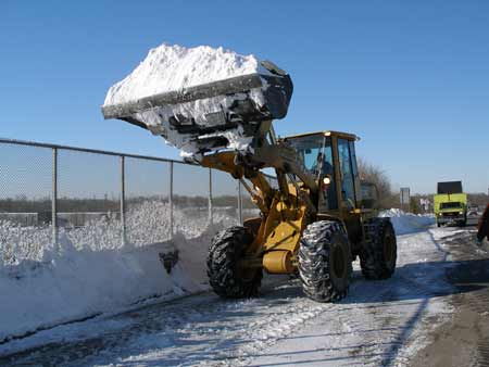 New Jersey Department of Transportation crews remove snow after a winter storm photo